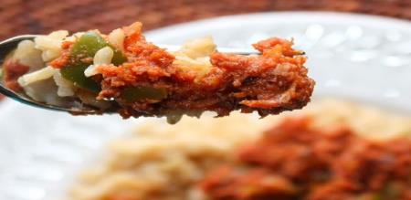 Bahamian nutritious breakfast Fire Engine Grits corned beef flavor with onions and tomatoes