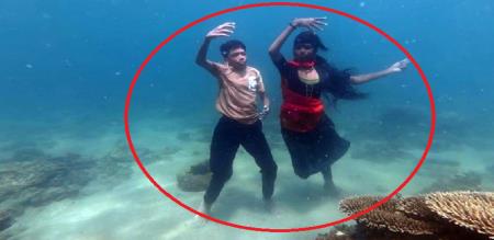 two childrens dance in under water for world dance day