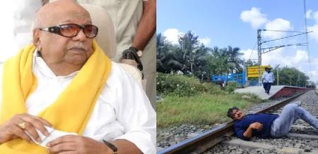 Mansoor Ali Khan lies on the tracks like Karunanidhi Mansoor Ali Khan performs a stunt in Kallakudi amidst election campaigning